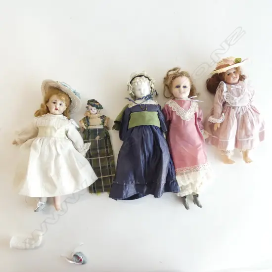Five antique dolls.